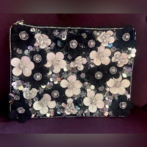 Clutch bag with 3D flowers from ASOS design. Used once.